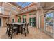 Outdoor patio with a fire pit and seating area at 5376 Shadow Lawn Dr, Sarasota, FL 34242