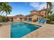 Inviting pool area with lounge chairs and spa at 5376 Shadow Lawn Dr, Sarasota, FL 34242