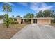 Bright, single-story home with a spacious driveway at 5402 Shadow Lawn Dr, Sarasota, FL 34242