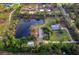 Aerial view of property showing house, pond, and surrounding land at 5645 Churchill Downs Rd, Sarasota, FL 34241