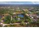 Aerial view of property showing house, pond, and surrounding land at 5645 Churchill Downs Rd, Sarasota, FL 34241