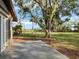 Spacious back deck overlooking a pond and lush lawn at 5645 Churchill Downs Rd, Sarasota, FL 34241