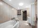 Modern bathroom with soaking tub, glass shower, and updated vanity at 5645 Churchill Downs Rd, Sarasota, FL 34241
