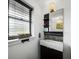 Modern bathroom with a floating vanity and window at 5645 Churchill Downs Rd, Sarasota, FL 34241