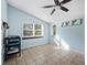 Bright and airy bonus room with tile floors at 5645 Churchill Downs Rd, Sarasota, FL 34241
