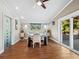 Bright dining room with hardwood floors and access to backyard at 5645 Churchill Downs Rd, Sarasota, FL 34241
