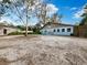 Light blue building with ample parking space at 5645 Churchill Downs Rd, Sarasota, FL 34241