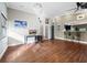 Home office with hardwood floors, desk, and built-in bar at 5645 Churchill Downs Rd, Sarasota, FL 34241