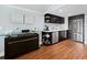 Basement wet bar with cabinetry, sink, and mini-fridge at 5645 Churchill Downs Rd, Sarasota, FL 34241