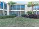 Condo building back exterior with screened patio at 6101 34Th W St # 28E, Bradenton, FL 34210