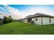 Large backyard with green grass and a home exterior view at 6138 162Nd E Ave, Parrish, FL 34219