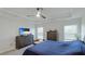 Bright bedroom featuring a comfortable bed and plenty of storage at 6138 162Nd E Ave, Parrish, FL 34219