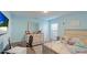 Light and airy bedroom with a queen bed and built-in desk at 6138 162Nd E Ave, Parrish, FL 34219