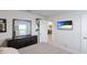 Comfortable bedroom with mounted TV and dresser at 6138 162Nd E Ave, Parrish, FL 34219