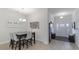 Charming dining area with a farmhouse table and entryway view at 6138 162Nd E Ave, Parrish, FL 34219