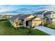 One-story home with a two-car garage, landscaping, and a neutral color palette at 6138 162Nd E Ave, Parrish, FL 34219