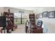 Home office with built-in shelving and a large desk at 6138 162Nd E Ave, Parrish, FL 34219