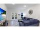 Comfortable living room with sectional sofa and access to a backyard patio at 6138 162Nd E Ave, Parrish, FL 34219