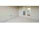 Covered patio with double french doors leading inside at 6138 162Nd E Ave, Parrish, FL 34219