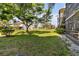 Landscaped backyard with lush green grass at 618 Bird Bay S Dr # 201, Venice, FL 34285