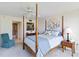Bedroom with a post bed, ceiling fan, and ensuite bathroom access at 618 Bird Bay S Dr # 201, Venice, FL 34285