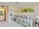 Bedroom with daybed, leafy decor, and mirrored closet at 618 Bird Bay S Dr # 201, Venice, FL 34285