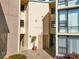 Sandpiper building exterior showcasing entrance and landscaping at 618 Bird Bay S Dr # 201, Venice, FL 34285