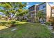 Building exterior showcasing manicured lawn at 618 Bird Bay S Dr # 201, Venice, FL 34285