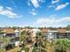 Two-story condo building with palm trees and green lawns at 618 Bird Bay S Dr # 201, Venice, FL 34285