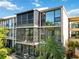 Condo unit with large windows and screened balcony at 618 Bird Bay S Dr # 201, Venice, FL 34285