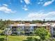 Condo building with a view of surrounding neighborhood at 618 Bird Bay S Dr # 201, Venice, FL 34285