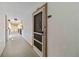 Residential hallway with apartment entry doors at 618 Bird Bay S Dr # 201, Venice, FL 34285