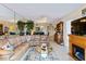 Open living room with sectional sofa and views into dining area at 618 Bird Bay S Dr # 201, Venice, FL 34285