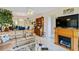 Living room features a large sectional sofa and built-in fireplace at 618 Bird Bay S Dr # 201, Venice, FL 34285