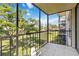 Spacious screened balcony with treetop views at 618 Bird Bay S Dr # 201, Venice, FL 34285