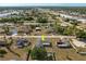 Aerial view showcasing a single-story house with a spacious backyard in a residential neighborhood at 625 Ennis Nw Ter, Port Charlotte, FL 33952