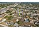 Aerial view of a single Gathering home in a residential neighborhood near main roads at 625 Ennis Nw Ter, Port Charlotte, FL 33952