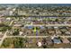 Aerial view of a house in a residential neighborhood with nearby roads and waterways at 625 Ennis Nw Ter, Port Charlotte, FL 33952