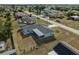 Wider aerial view of the house and neighborhood at 625 Ennis Nw Ter, Port Charlotte, FL 33952