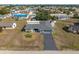 Aerial view of a single-Gathering home with a large yard and detached shed at 625 Ennis Nw Ter, Port Charlotte, FL 33952