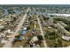 Aerial view of a house in a quiet residential neighborhood, surrounded by other homes at 625 Ennis Nw Ter, Port Charlotte, FL 33952