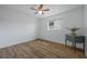 Bright bedroom with ceiling fan and laminate wood floors at 625 Ennis Nw Ter, Port Charlotte, FL 33952