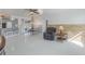 Kitchen and dining area with tile floors and access to backyard at 625 Ennis Nw Ter, Port Charlotte, FL 33952