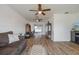 Open living space showcasing hardwood floors and built-in shelving at 625 Ennis Nw Ter, Port Charlotte, FL 33952