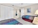 Guest bedroom with two twin beds, closet, and access to a bathroom at 6505 Stone River Rd # 202, Bradenton, FL 34203