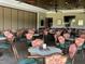 Spacious dining room with numerous tables and chairs at 6505 Stone River Rd # 202, Bradenton, FL 34203