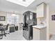 Kitchen with black appliances and white cabinets at 6505 Stone River Rd # 202, Bradenton, FL 34203