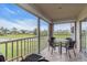 Screened-in patio with table and chairs at 6505 Stone River Rd # 202, Bradenton, FL 34203