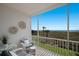 Serene balcony with ocean view and wicker furniture at 6925 Gulf Of Mexico Dr # 24, Longboat Key, FL 34228