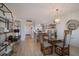 Open dining area with glass top table and bamboo chairs at 6925 Gulf Of Mexico Dr # 24, Longboat Key, FL 34228
